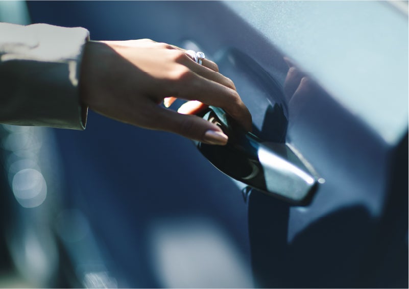 A hand gracefully grips the Light Touch Handle of a 2023 Lincoln Aviator® SUV to demonstrate its ease of use | Pugmire Lincoln of Marietta in Marietta GA
