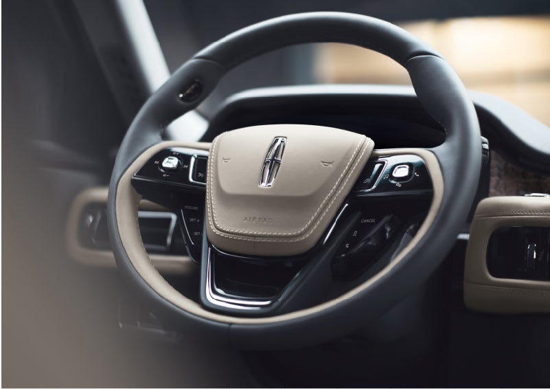 The intuitively placed controls of the steering wheel on a 2023 Lincoln Aviator® SUV | Pugmire Lincoln of Marietta in Marietta GA
