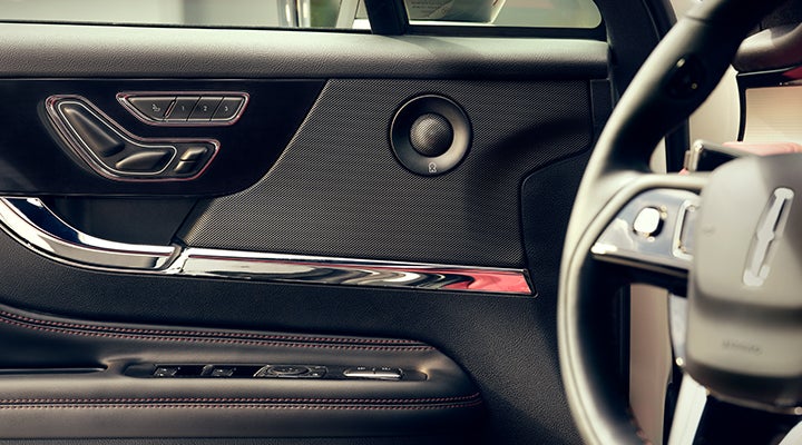 A Revel® audio speaker is shown in the driver’s side door of a 2024 Lincoln Corsair® SUV. | Pugmire Lincoln of Marietta in Marietta GA